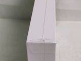 a white box that has a toothbrush in it