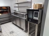 a kitchen with stainless steel cabinets and a microwave