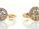 two gold rings with diamonds on a white background