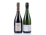 two bottles of wine sitting next to each other on a white surface