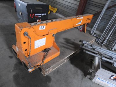 a crane that is sitting in a garage