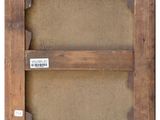 an old wooden frame with a label on it
