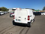 a white van that is parked in a parking lot