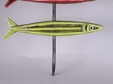 three fish on a stick on a white background