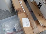 a pile of boxes and a pair of scissors on the floor