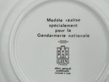 a white plate with a black and white picture on it