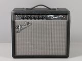 a black and white guitar amplifier sitting on top of a table