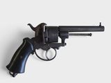a close up of a revolver on a white surface