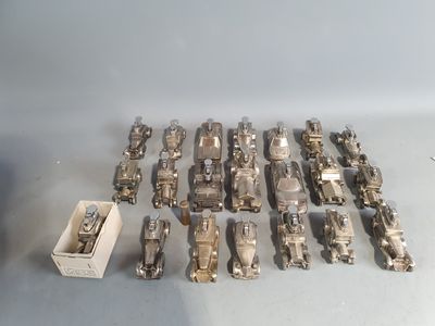 a lot of silver toys that are sitting on a table