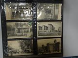 a picture of a display case with pictures of old buildings