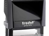 the stamper is black and white with the word trodat printed on it