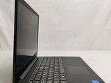 an open laptop computer sitting on top of a white table