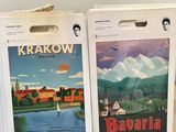 two boxes of books on a table with a picture of a town