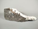 a rock that has some snow on top of it