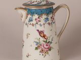 an image of a tea pot with flowers on it