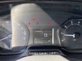 a close up of a car dashboard with a speedometer and gauges