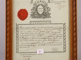 an old document with a wax seal and a wax stamp on it
