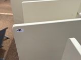many computer screens sitting in a row on the ground