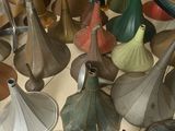 many different colored umbrellas on the floor in a room