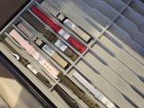 a drawer full of different types of watches and watches