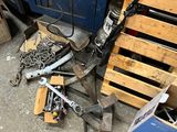 a pile of tools sitting on the floor next to a pallet