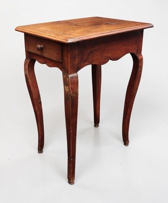 a small wooden table with a drawer underneath it
