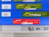 a stack of boxes with labels on them on a shelf