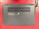 a laptop that is sitting on a red surface