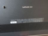 a close up of a laptop with a label on it
