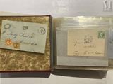 two old envelopes are sitting in a box on a table
