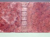 a red book that is sitting on a table