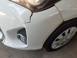 a close up of a car that has a denting on it