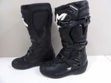 pair of black motorcycle boots with white logos on them sitting on a white surface