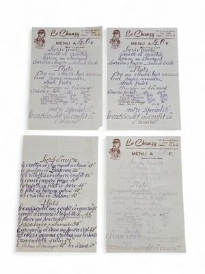 four letters written on a piece of paper with a picture of a man