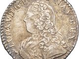a silver coin with an image of a man in profile