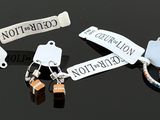 three key chains that have different types of tags on them