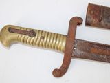 a very old and rusty knife on a white surface