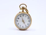 an image of a gold pocket watch on a white background