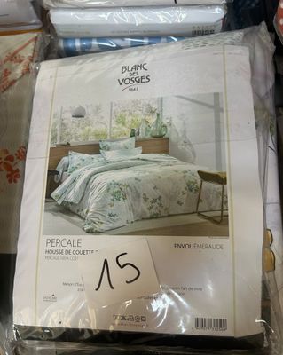 a lot of bedding items on display in a store