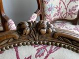 two chairs that are sitting next to each other