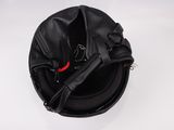 a black helmet with a red and blue ribbon on it