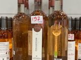 several bottles of wine are lined up on a counter