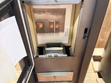 a refrigerator that is open and has a lot of papers in it