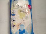 a bag of baby comfort items on a table