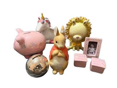 a small collection of figurines including a piggy bank, a piggy bank, a piggy bank, a piggy bank, and a