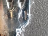 a plastic fork wrapped in plastic on a table