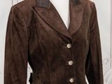 a woman ' s brown jacket on a mannequin mannequin mannequin mannequin mannequin mannequin mannequin mannequin
