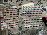 a display case with a bunch of earrings on it