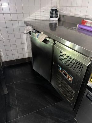 a stainless steel counter in a small kitchen