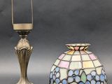 pair of antique stained glass lamps and a brass candle holder